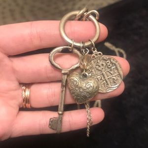 Long statement necklace with key, heart & coin